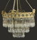 OVAL GILT BRASS CRYSTAL CHANDELIER, C. 1925