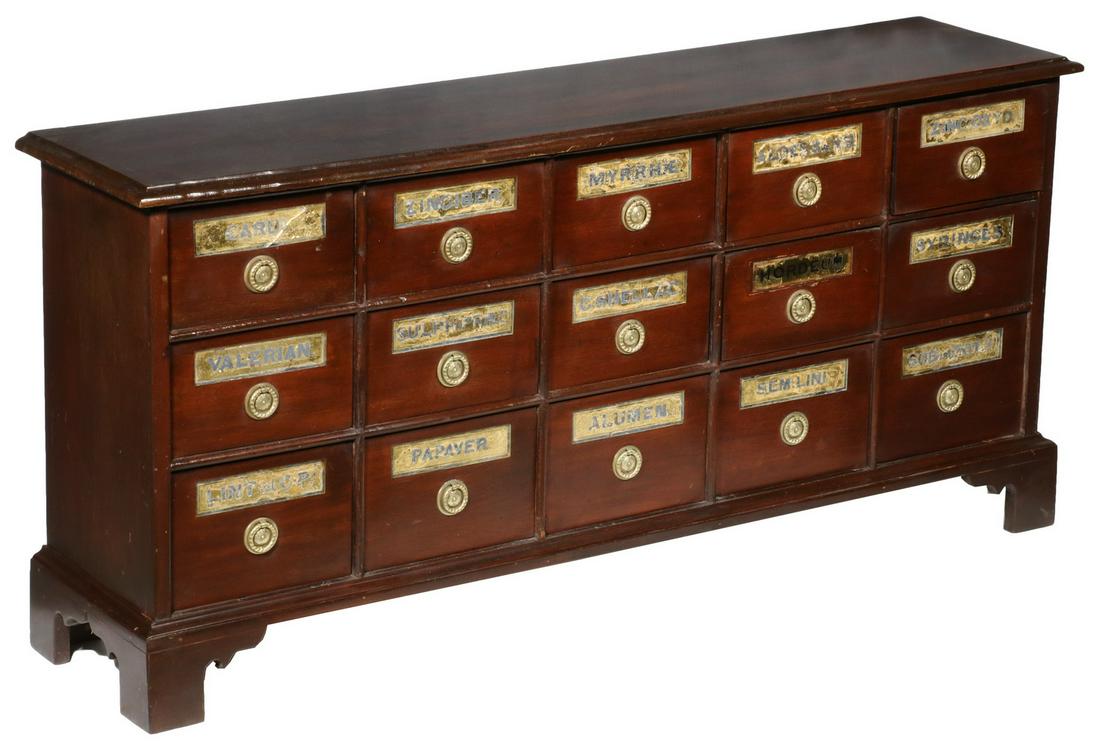 APOTHECARY CABINET: 19th c. Cherry 15-Drawer Countertop Apothecary Cabinet, with molded edge overhanging top, fifteen dovetailed drawers, each with inset glass-topped gilded foil and black lettered label, set on molded b