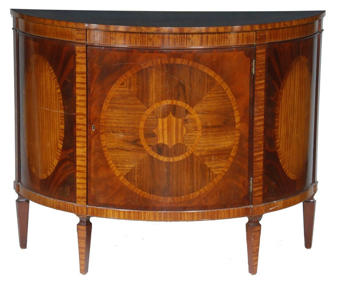 HEPPLEWHITE STYLE DEMILUNE HALL CABINET BY BAKER: "Historic Charleston Reproductions" Cabinet in exotic wood veneer marquetry, featuring an overhanging top with half fan and cross banded edge, the single door cabinet over a two shelf interior, decora