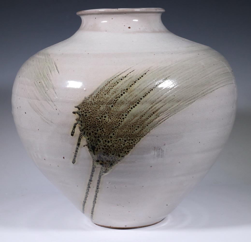 PAUL CHALEFF (US, 1947- ) CERAMIC VESSEL: Large Glazed Stoneware Ovoid Vase, signed "Paul Chaleff" to side just above base, wood fired, coiled construction with flared rim, tan glaze with green abstract decoration, examples of Chaleff's works
