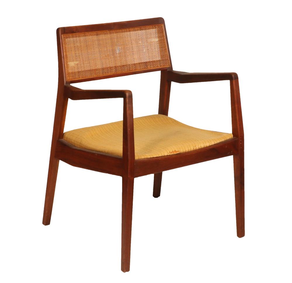 JENS RISOM 'PLAYBOY' C-140 ARMCHAIR: Mid-Century Teak with gold upholstered seat, tight-weave caned back, designer's label on the underside, 17" seat, 26 1/2" arms, 35 1/2" back, 22" x 21". Loss to finish, caning punctures.