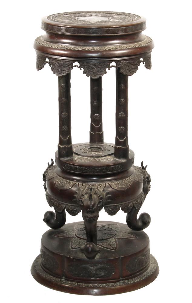 JAPANESE MEIJI PERIOD BRONZE PEDESTAL: High Quality Well Decorated Open Pedestal with bas relief lappet medallion top, Greek key edge, pendant lobes featuring koi and phoenix, three tapered round columns having sets of three mon in ranks, 