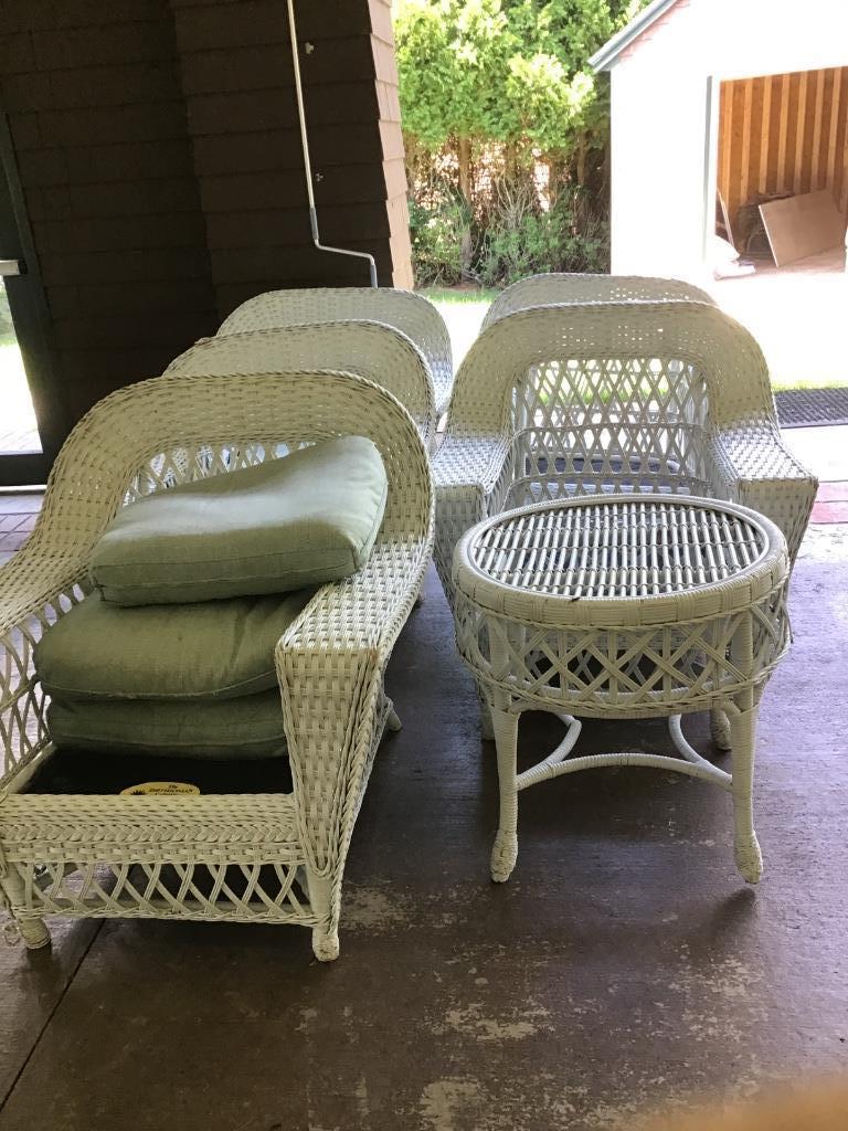 WICKER FURNITURE: Six (6) piece lot of vintage style white painted wicker with five (5) arm chairs and one (1) end table. The Smithsonian Collection by Henry link. Several items have broken legs and missing cushions.