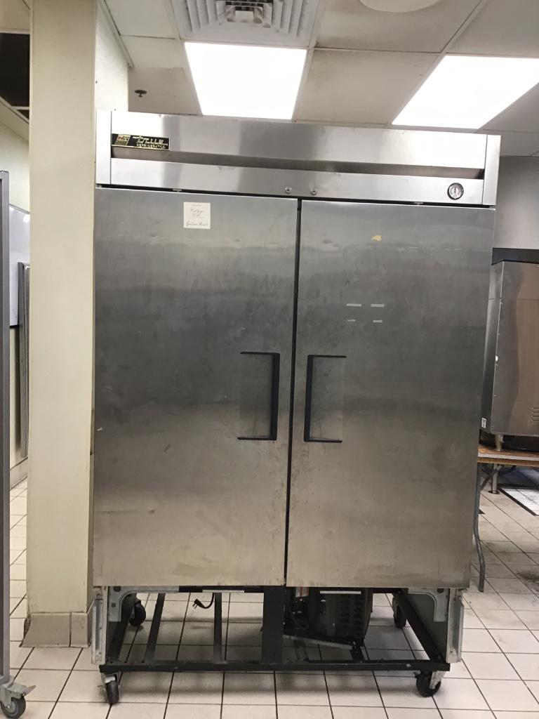 TRUE TWO SECTION REACH IN REFRIGERATOR: TRUE T-49 two section reach in refrigerator, lower grill missing.