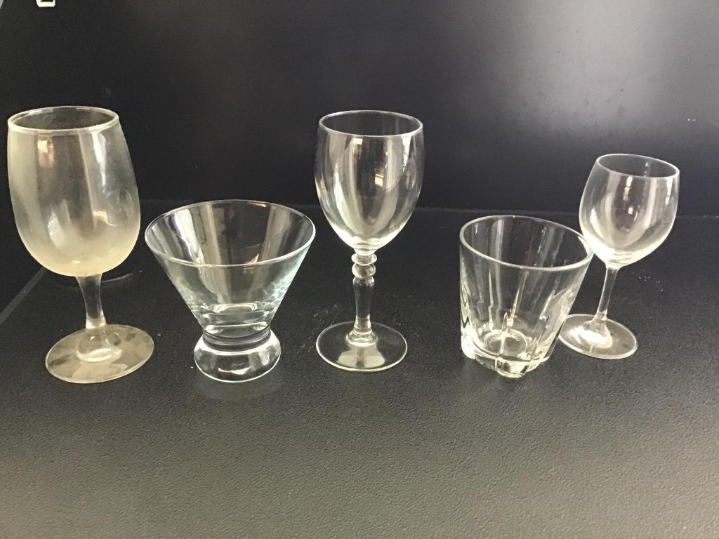 204 GLASSES & STEMWARE: Lot of (204) mixed glasses and stemware, wine glasses, rocks glasses, sherbet glasses, in eight glass racks