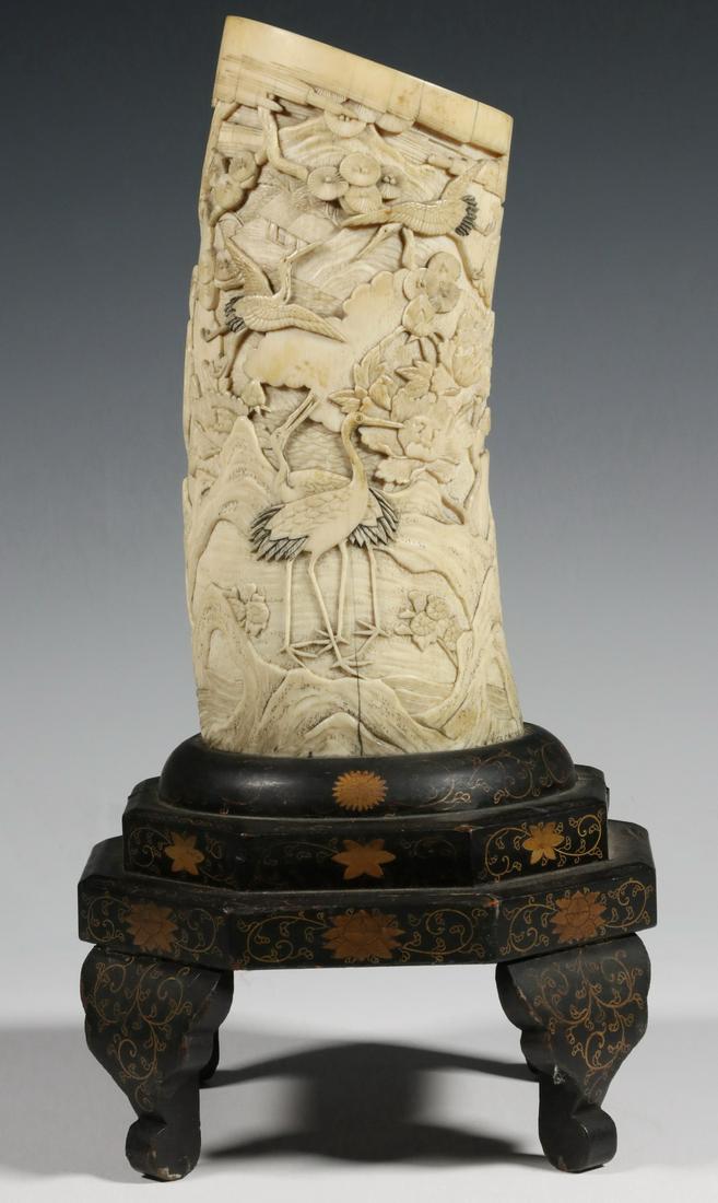 19TH C. JAPANESE VASE ON LACQUERED WOOD BASE: Beautifully Carved Meiji Landscape Pot with three couples of Cranes and a single Phoenix, among pine trees, blossoms, gnarled rocks, water and a single cottage, the stepped, fitted and footed base in 
