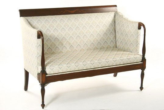 Mahogany Settee Sheraton Bellflower Inlay Uphols: SETTEE - Sheraton style mahogany settee. Scroll back crest rail with swag and bellflower inlay. Exposed goose neck arm rests, set on fluted turnings over matching legs. Upholstered in an ivory tapestr