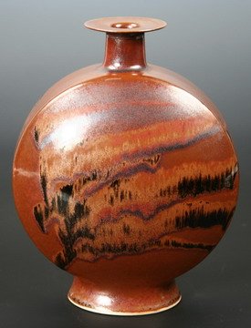 Brother Thomas Bezanson Flask Form Vase Black: VASE - Footed flask form vase with raised neck and wide flared rim by Brother Thomas Bezanson (VT/PA, 1929-2007). Brown glaze with flowing black glaze, inscribed on bottom Benedictine Monks, Weston Ve