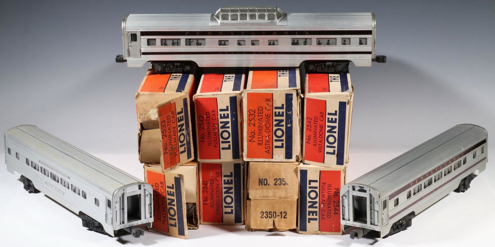 (8) BOXED LIONEL TRAIN ITEMS - (7) CARS PLUS LOCOMOTIVE: Lionel O-Gauge Model Train Lot, post-war, with original boxes, incl: EP-5 electric locomotive #2350, New Haven, black, orange and white; and Illuminated Pullman Car #s 2532, 2533, 2534, 2541, 2542, 25