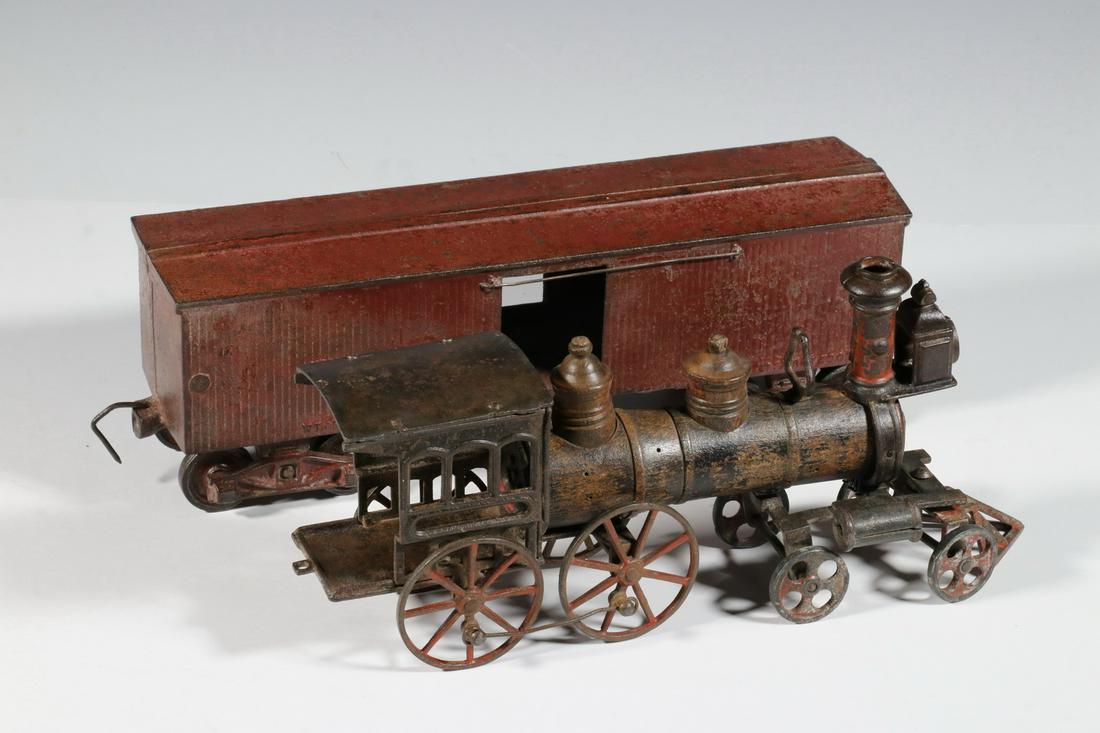 WELKER & CROSBY FLOOR TRAIN ENGINE & WILKINS TOY CO.: Lot of (2) Late 19th c. Floor Train Cars, incl: 1880s cast iron & wood locomotive by Welker & Crosby (Brooklyn, NY), base marked 'W&C' with crescent and 'Nov. 10, '85', 5 1/4" high, 12" x 2 1/2", miss