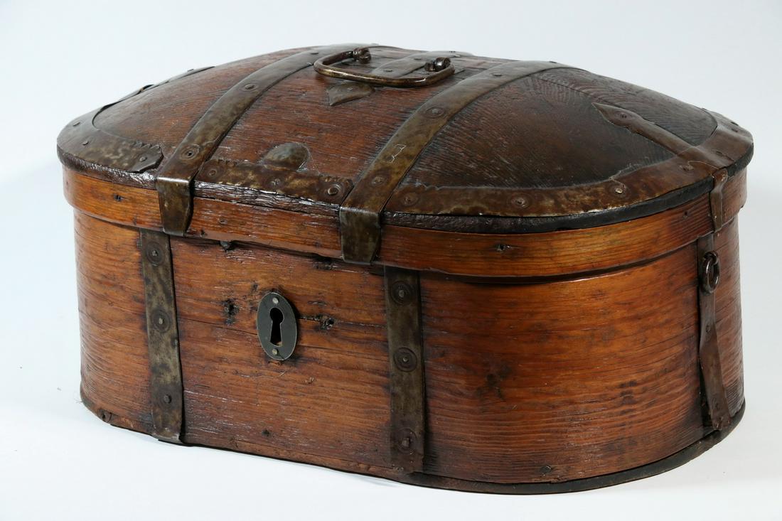 SWEDISH DOME TOP TRAVEL BOX: 18th c. Scandinavian Folk Art Iron Bound Wooden Travel Box, oval shape with hand wrought iron strapping surrounding lid and box sides, top carry handle, side ring handles, iron escutcheon (no key or l