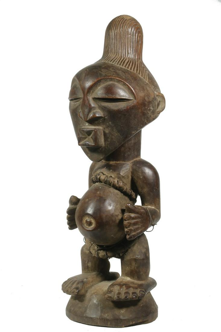 19TH C. SONGYE FEMALE FIGURE WITH ORNAMENTATION, DRC: Exemplar of type, 'Bishimba' Fertility Figure of Pregnant Woman, Songye people, Democratic Republic of Congo (formerly Zaire), with fibre and wire binding, nut pod bound at small of back, hands restin