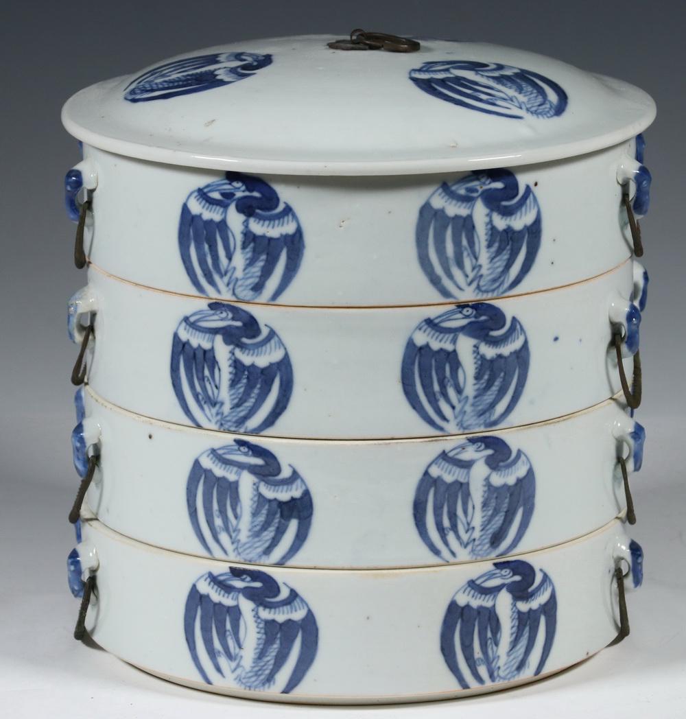 18TH C. CHINESE BLUE & WHITE ROUND PORCELAIN SECTIONAL: Four-tier Nesting Food Carrier in white porcelain with blue decoration of cranes and bats repeating on each, twisted wire handles, domed top with the same crane medallions and central metal loop lift,