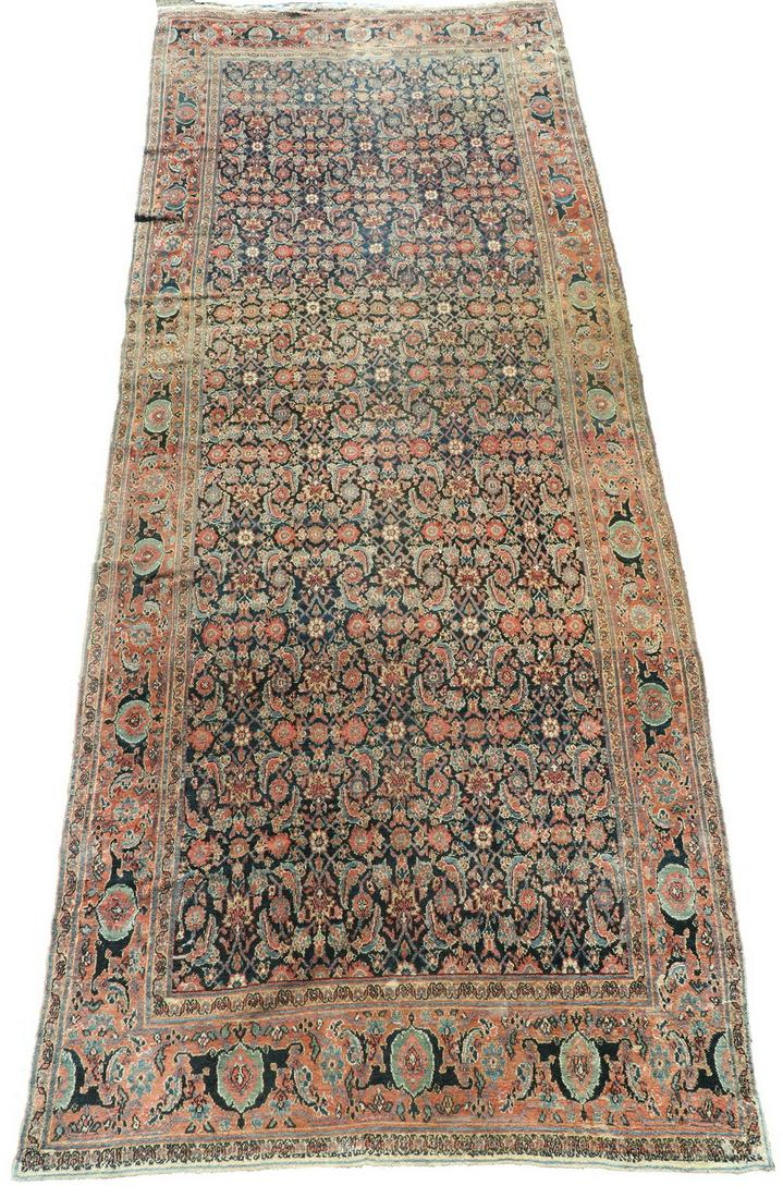 HAMADAN 'LONG ' RUG - 5'-7" x 15': Northwest Persia, dense overall Herati design in rust, royal and sky blue, gold and beige on the midnight blue field, rust 'turtle' border. Even wear. 67" wide x 15' long. Provenance: From the Mead Fa