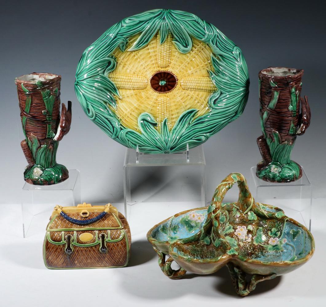 (5 PCS) MAJOLICA DISHES, INCL GEORGE JONES: Collection of (5) Majolica Pottery Dishes, incl: Victorian strawberry basket by George Jones, stamped with GJ cypher and with registry mark for April 25, 1873, floral and leaf decorated, with carry ha