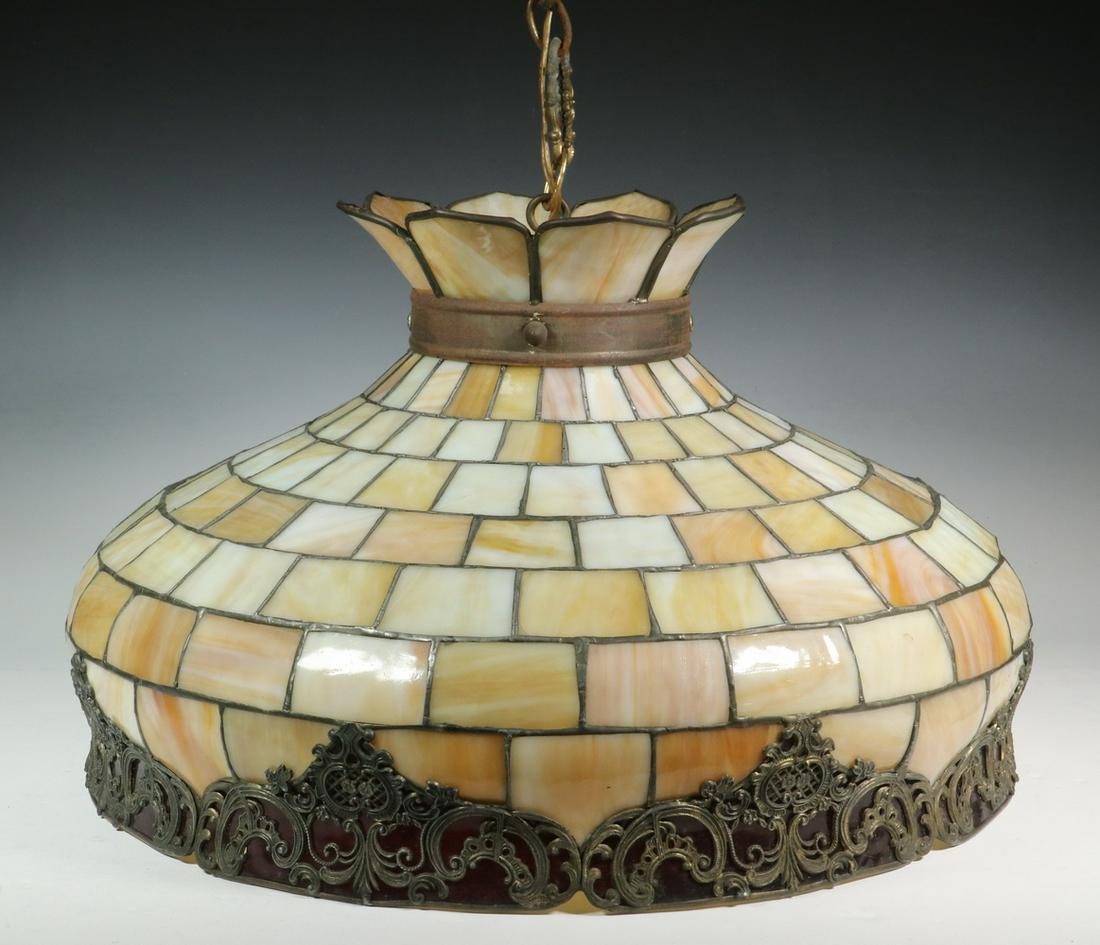 LEADED SLAG GLASS HANGING LIGHT: Vintage Slag Glass Hanging Light Fixture, mid-20th c., with leaded shade fitted with caramel slag glass, base rim with pierced metal trim above red glass panels, single socket fixture with cord and pl