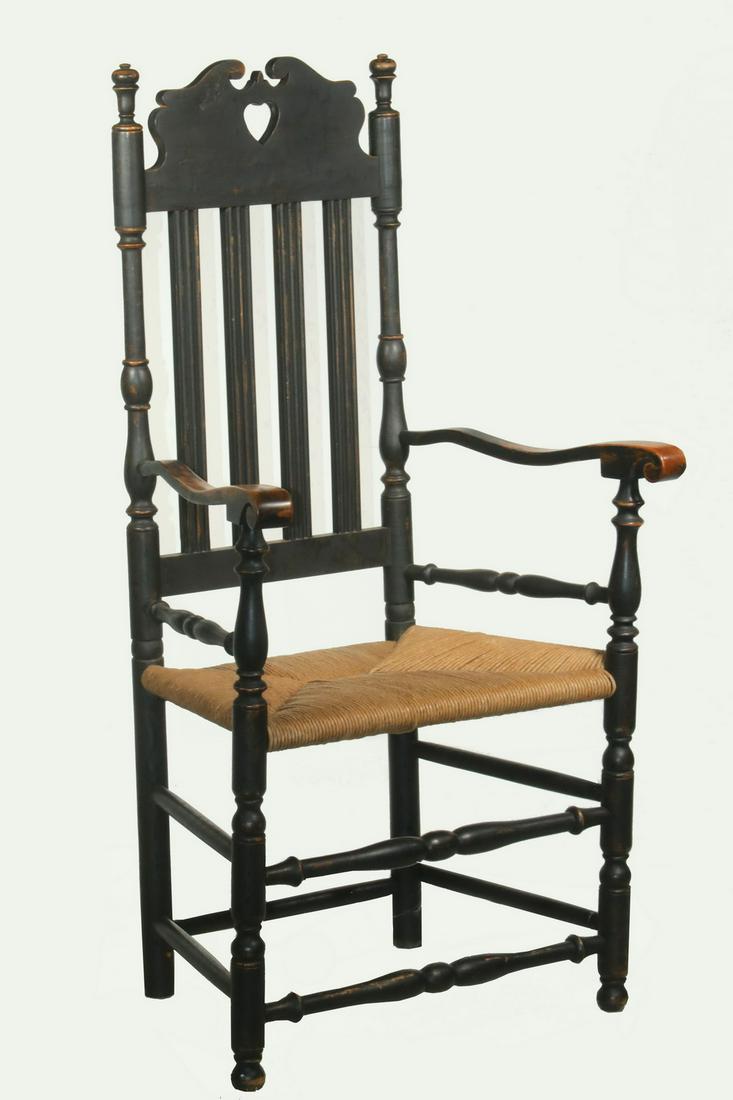 PAINTED BANISTER BACK ARMCHAIR: Custom Black Painted Armchair, by Stephen D. Vanormer (Strasburg, PA), shaped crest rail with heart cut-out, four reeded back slats, scrolled arms, woven rush seat, turned front stretchers, maker's la
