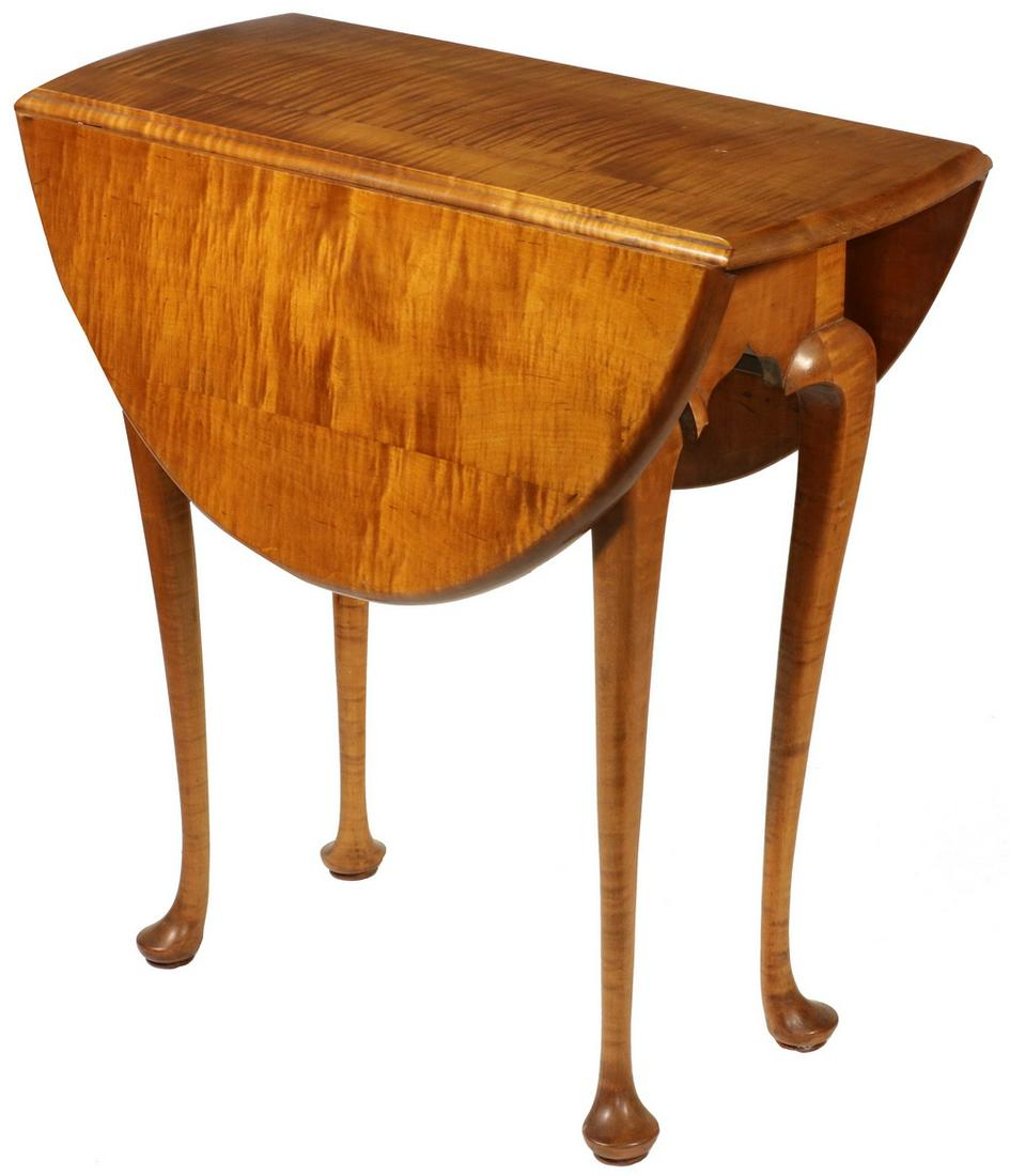 TIGER MAPLE DROP LEAF TABLE: Diminutive Queen Anne Style Oval Drop Leaf Swing Leg Table, in tiger maple, 26" high, 26" x 33" (leaves up, 11" with leaves down). Good condition. Provenance: From the Mead Family Estate, Islesboro ME