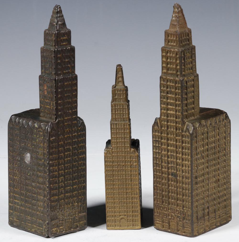 (3) WOOLWORTH BUILDING IRON STILL BANKS BY KENTON: Group of (3) Early 20th c. Cast Iron Still Banks, made by the Kenton Hardware Company, depicting New York City's Woolworth Building (completed in 1913), both with original painted surface, including (