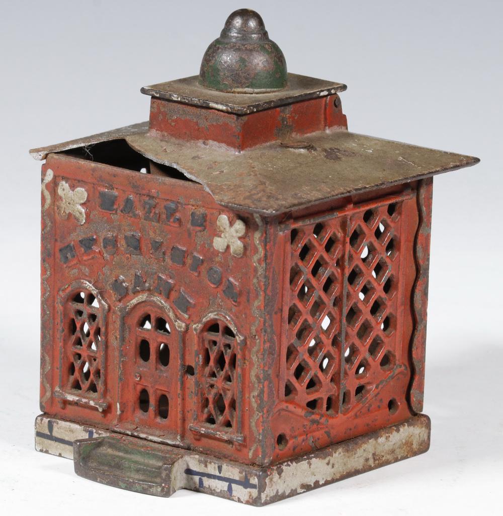 HALL'S EXCELSIOR CAST IRON MECHANICAL BANK: Late 19th c. Mechanical Bank, designed by John Hall and manufactured by J. & E. Stevens, Cromwell, CT, with original painted surface, lift the cupola and place a coin by the wooden teller, when cupola