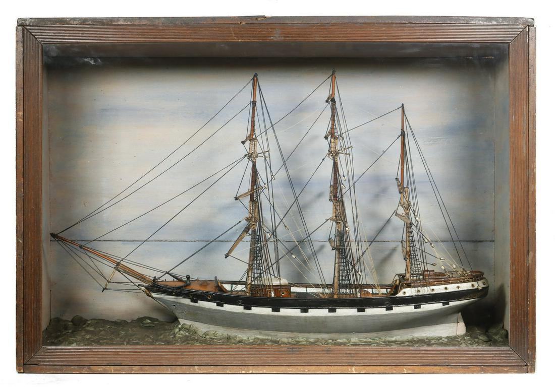 19TH C. SHIP DIORAMA: Full Hull Model in Case of a Three Mast Ship, probably American, having a grey hull and faux painted gun ports, circa 1880, fully rigged but without sails, still depicted underway in modeled plaster s