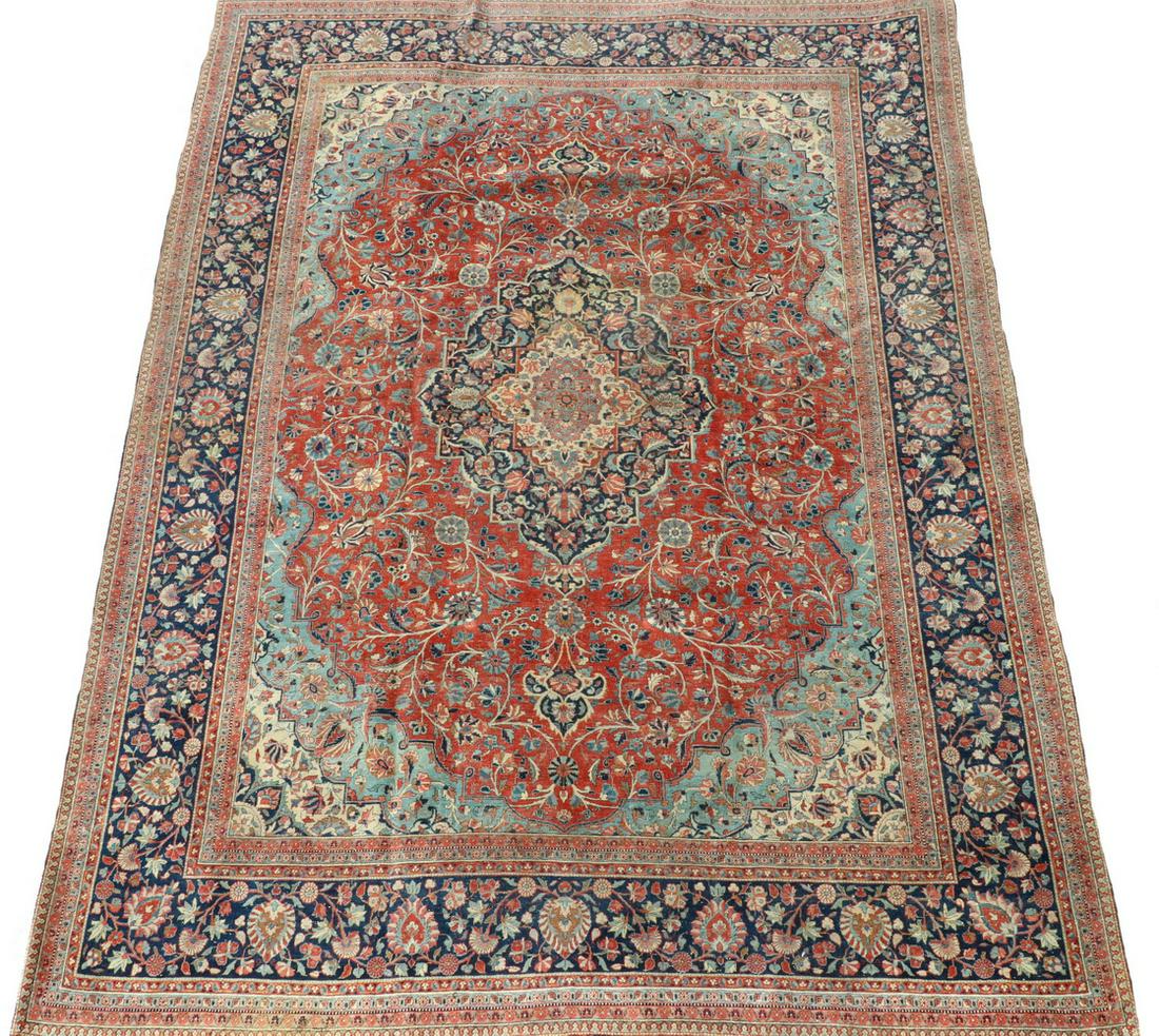 KASHAN CARPET - 8'-10" x 11'-8": West Central Persia, first quarter 20th c., Lobed oval medallion with matching spandrels and anchor pendants, with flowering vines, rosettes and palmettes in gold, sky and midnight blue, blue-green an