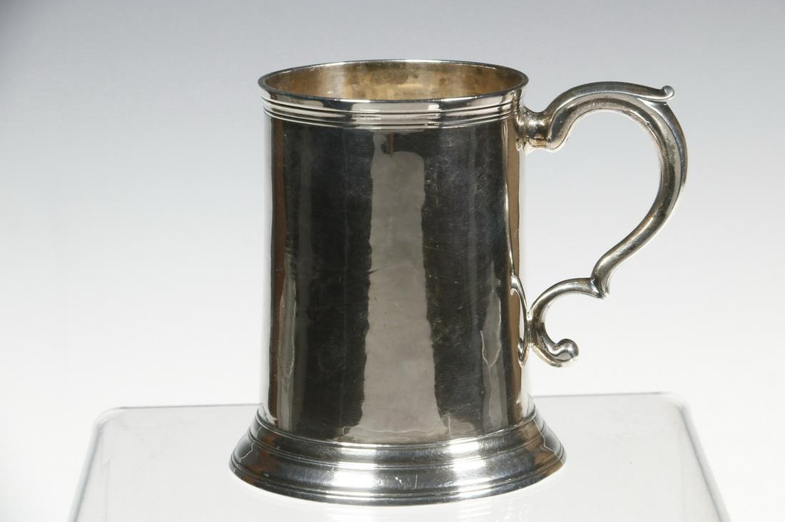 GEORGE III SILVER CANN BY JOHN LANGLANDS I: English Sterling Silver Mug, hallmarked for Newcastle, 1774 by silversmith John Langlands I, tapered cylindrical shape with scroll form handle, stepped base, 3 3/4" high, 4 1/4" x 3 1/4", 5.82 ozt tw.