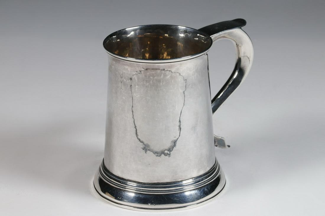 GEORGE III SILVER CANN BY FRANCIS CRUMP: English Sterling Silver Mug, hallmarked for London 1768 by silversmith Francis Crump, tapered cylindrical shape, flat top scroll form handle with engraved "L IM" monogram, slightly flared rim with sin