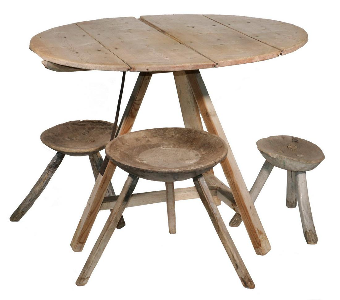 FRENCH WINE TASTING TABLE WITH (3) GRADUATED STOOLS: Scrubbed Pine Round Table with plank top, tripod base, T-stretcher, forged iron brace, 29" x 38" diam.; PLUS (3) Graduated Dish Top Three-Legged Stools, 17" x 16" diam., 23" leg to leg down to 12" x 1