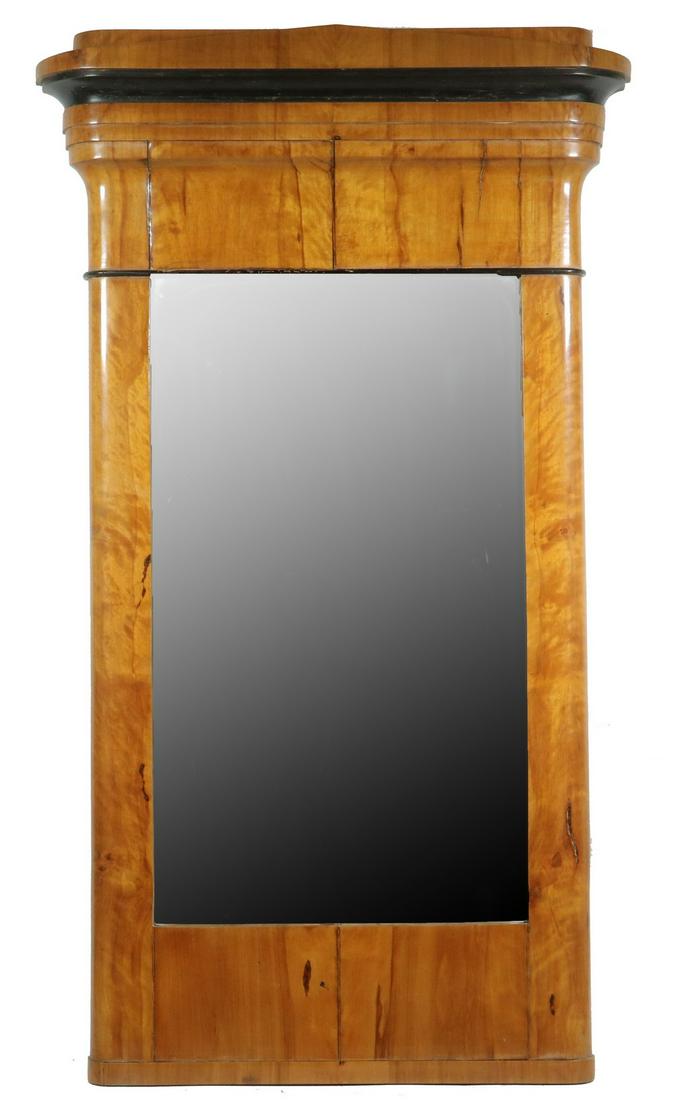 BIEDERMEIER WALL MIRROR: Elegant Wooden Frame in maple and ash veneer, with an ebonized rank in the stepped crown, quarter round sides, 39" x 22 1/2" x 3". Filled shrinkage cracks. Provenance: From the Estate of Rosemarie Wol