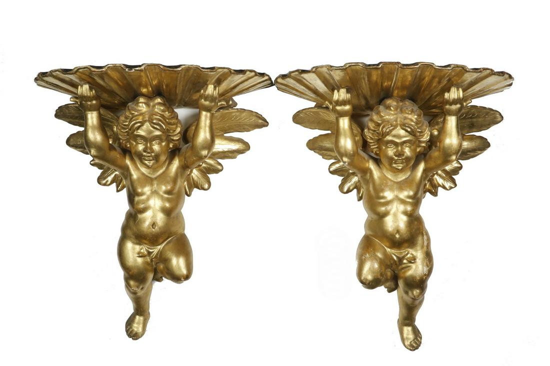 PR OF 19TH C. ITALIAN GILT CHERUB BRACKETS: Carved Giltwood Wall Brackets of Cherubs supporting seashells, 13" x 10 1/2" x 8 1/2". Old repair to wing, otherwise good condition.