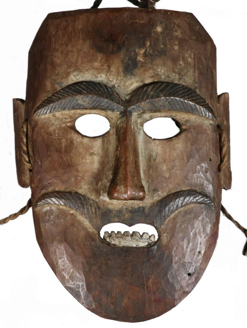 19TH C. NEPALESE MASK: Nepalese Mask, middle hills, probably Tamang/Magar, the mask with dark encrusted patina and carved painted facial hair, bared silver painted teeth, retaining the original fibre cords with cloth and le
