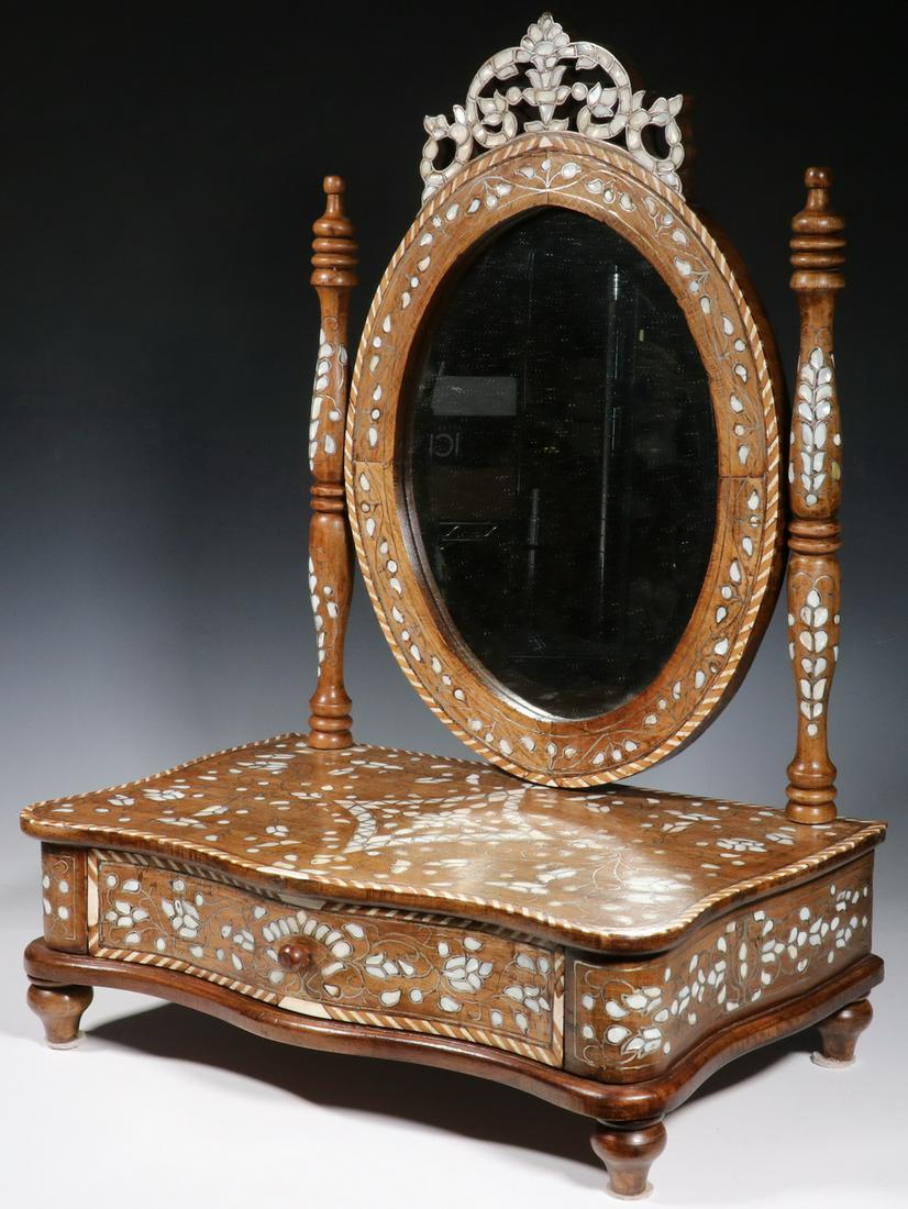 SYRIAN LADY'S INTARSIA INLAID VANITY MIRROR: 20th c. Tabletop Tilting Mirror on one-drawer base, in sycamore wood with silver, mother-of-pearl and bone inlay, having an ornate crest, turned finial top stanchions, beveled mirror, serpentine front