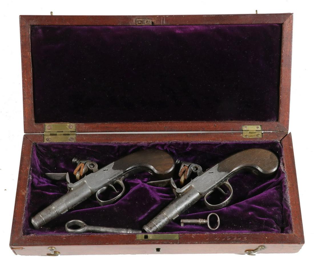 BOXED PR OF FLINTLOCK POCKET PISTOLS BY THE GREAT: Fine Quality .44 cal. Pocket Pistols with chased decoration, marked "Heylin, Corn Hill London", and with matching 1780s proof marks, walnut butts, in the original mahogany case with purple velvet lini