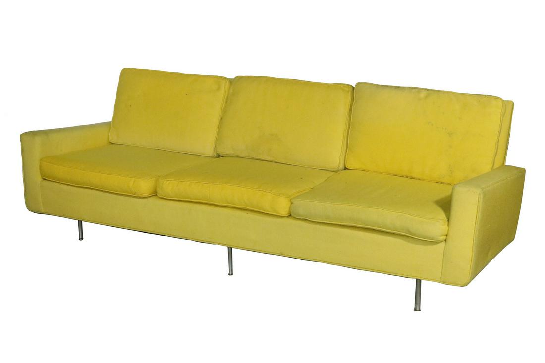 FLORENCE KNOLL SOFA IN YELLOW FABRIC: 1960s Long Sofa in canary yellow wool upholstery, with self-corded loose seat and back cushions, 15" seat, 20" arms, 32" back, 88" x 28". Impressions to fabric on back, some soiling.