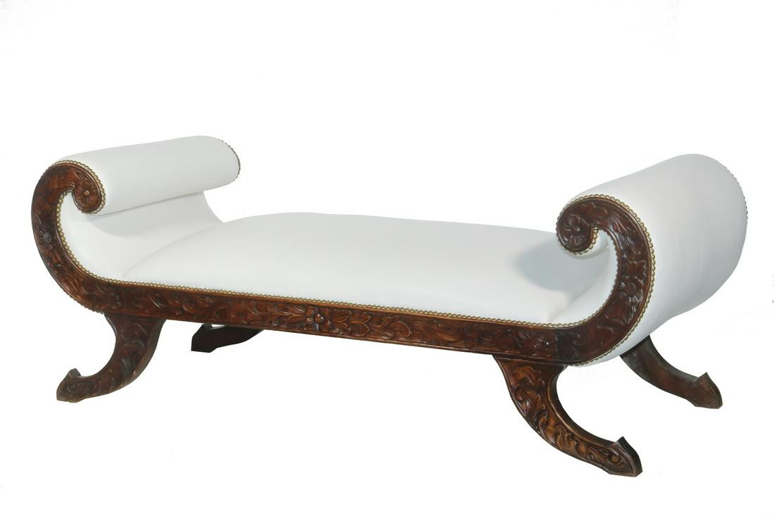 MAHOGANY CLASSICAL STYLE BENCH: Custom Carved Mahogany Bench, with scrolled ends and feet, front and back with intricate relief carved floral decoration, white leather upholstery and brass tacks, 22 3/4" high, 60" x 23 1/2". Good co