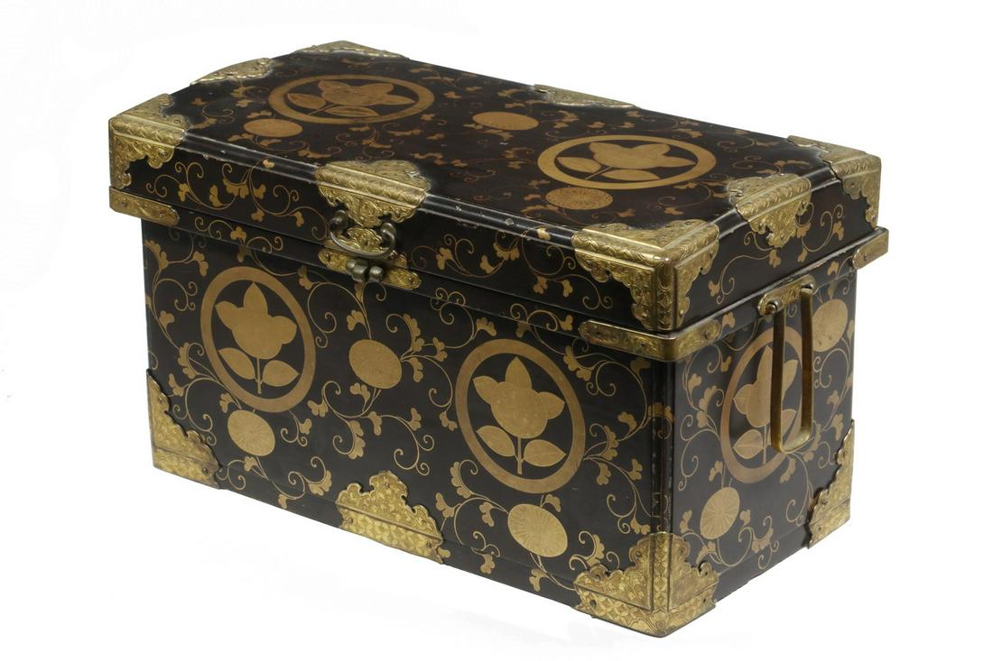 JAPANESE EDO PERIOD MAKI-E LACQUER BOX: 18th c. Japanese Lacquered Storage Box, with gilded and engraved copper mounts, hinged lid, side handles, lid lift with hasp, surface decorated with family crest and trailing vines, 5 3/4" high, 10 1/