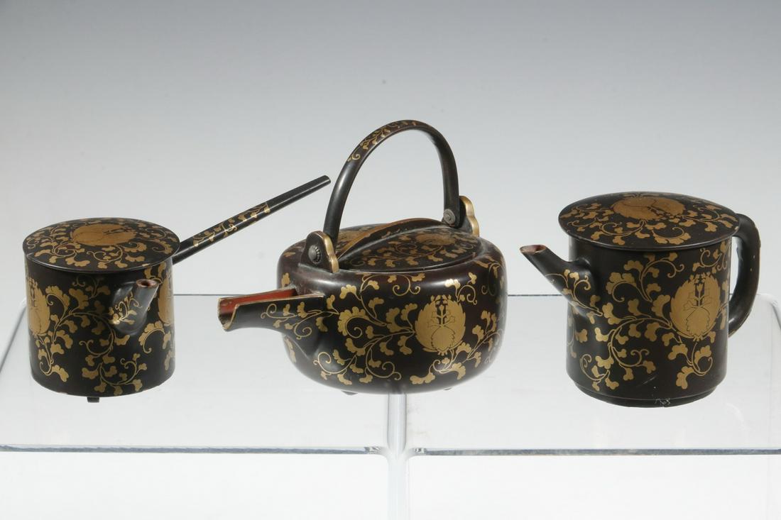 (3) JAPANESE MAKI-E MINIATURE EWERS: Lot of (3) Late Meiji Period Maki-e Lacquer Lidded Sake Vessels, with floral and trailing vine decoration, 2 3/4" high, 4 1/4" x 2 5/8", 2 1/2" high, 5 1/4" x 3" and 3 3/4" high, 4 3/4" x 3 1/4". Good