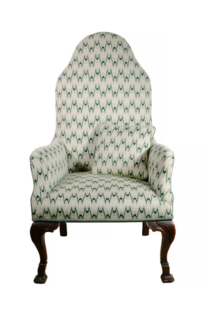 UPHOLSTERED ARMCHAIR: Open back upholstered armchair in a flame stitch set on mahogany legs with a carved knee and French style foot. Comes with matching throw pillow. 48" high, 28" x 24". Good condition.