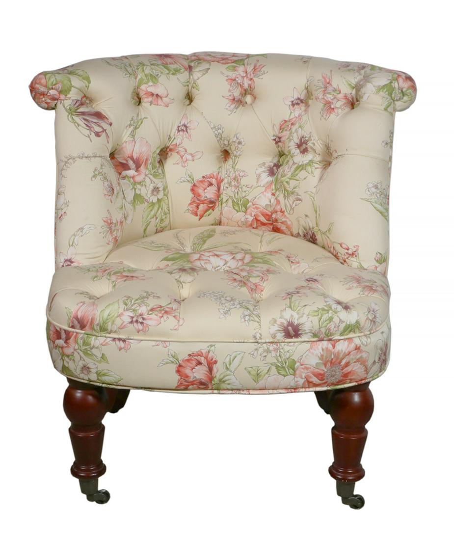 BOUDOIR CHAIR: Diminutive custom upholstered chair with diamond tufted upholstered floral chintz fabric. Mahogany turned front legs on castors. 26" high, 27" x 26". Very good condition.