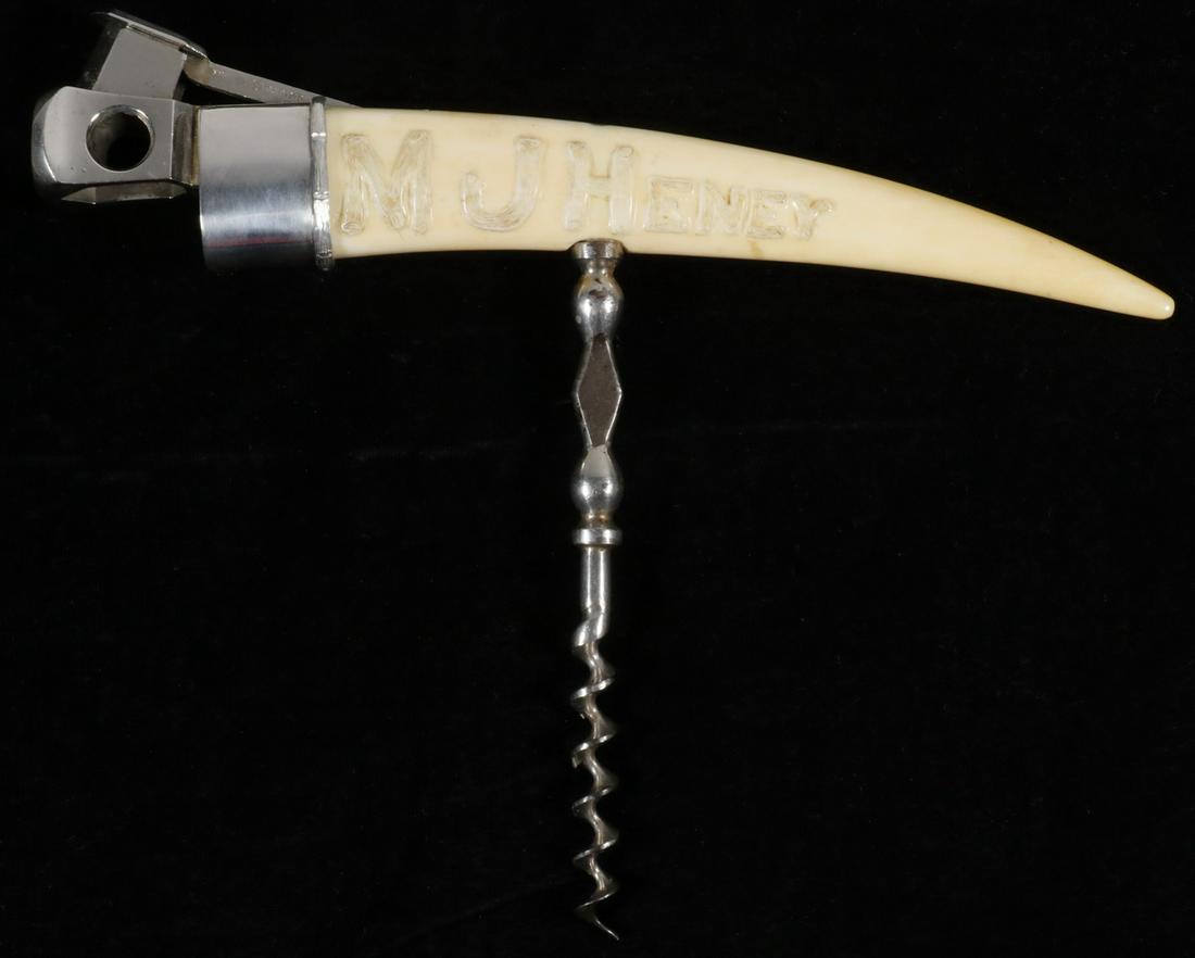 SILVER MOUNTED CIGAR CUTTER & CORKSCREW: Combination Cigar Cutter & Corkscrew, comprised of sterling silver mounted walrus tusk, carved 'M.J. Henry', with stainless steel cutter (marked Pfeilring, Solingen, DRGM) and iron corkscrew, silver m