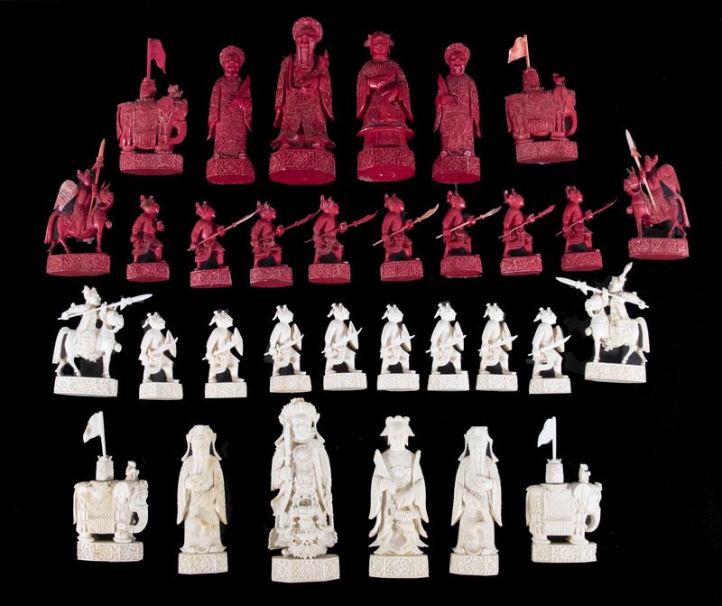 CHINESE CARVED CHESS SET: Mid-19th c. Chinese Export Canton Figural Chess Set, finely carved in white and dyed cochineal red, total of (32) pieces, 2 3/4" to 5 1/2" high. One red soldier missing his weapon, a few chips/minor l