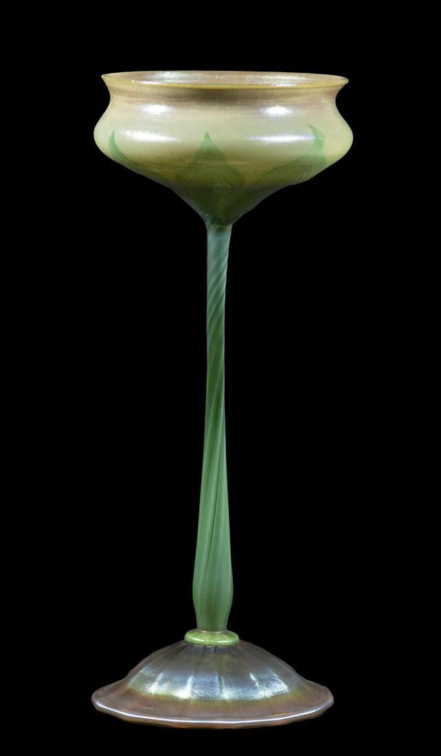 TIFFANY STUDIOS FAVRILE VASE: Circa 1910 Art Glass Floriform Tall Vase, with pulled feather motif bowl decoration, set on a slender stem and iridescent ribbed inverted saucer form foot, signed 'L.C.T.' at underside edge, remnant o