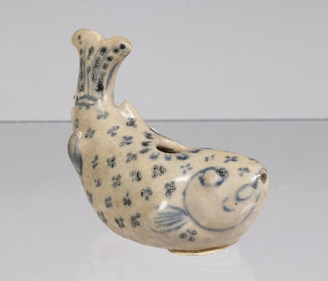 15TH C. VIETNAMESE FISH FORM WATER DROPPER: Blue and White, with label from "Saga-Hoi An Hoard-Visal", no. 11056, and second label from Robert McPherson of London no. HH6; 2 1/2" long. Good condition. Provenance: From the Estate of Frank Cowan.