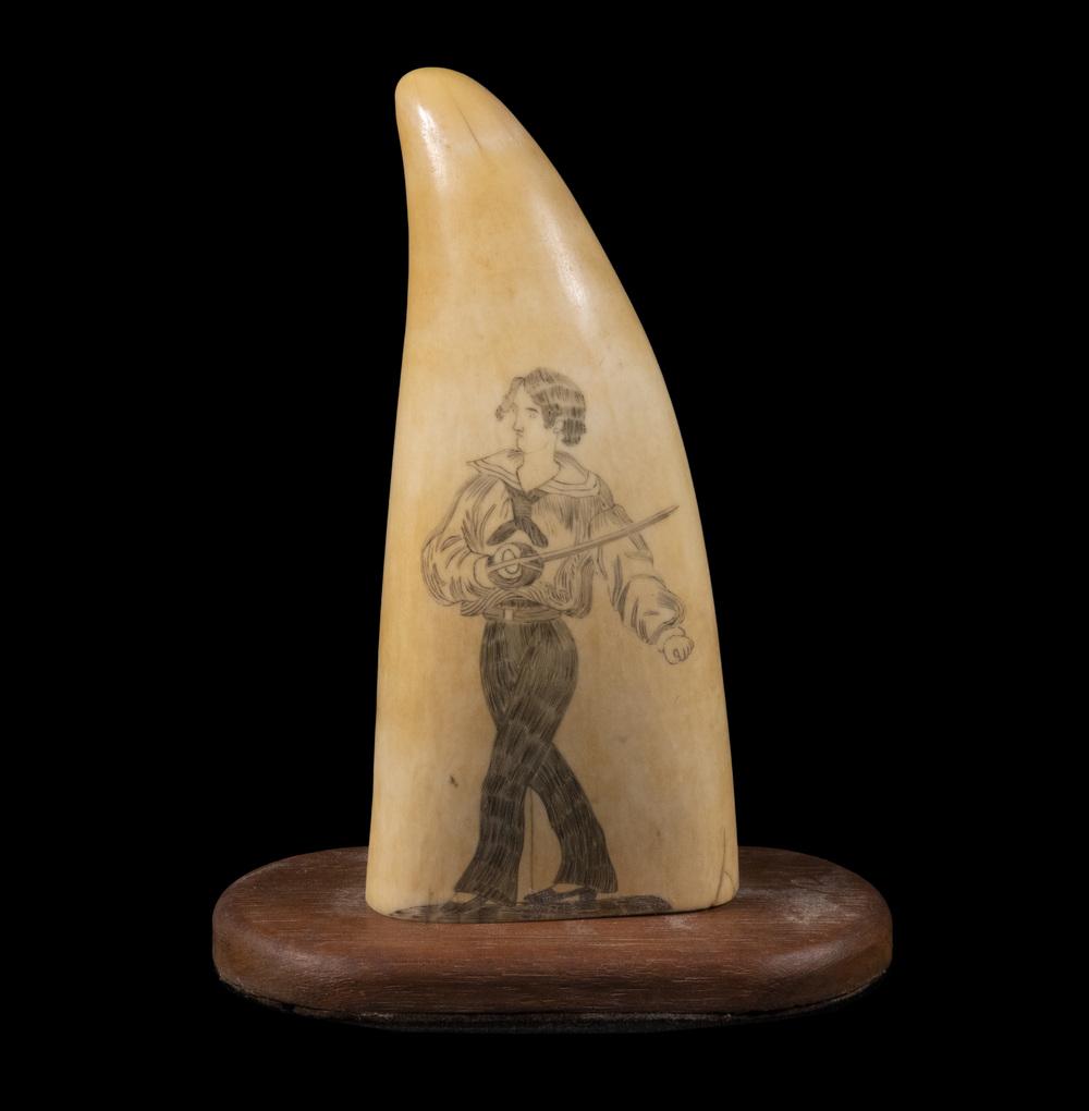SCRIMSHAW DECORATED WHALE TOOTH: 19th c. Sperm Whale Tooth, with decoration depicting a sailor with cutlass, set on a custom wooden stand, tooth only: 5 1/2" high, with stand: 6" high, 4 1/2" x 2 1/4".