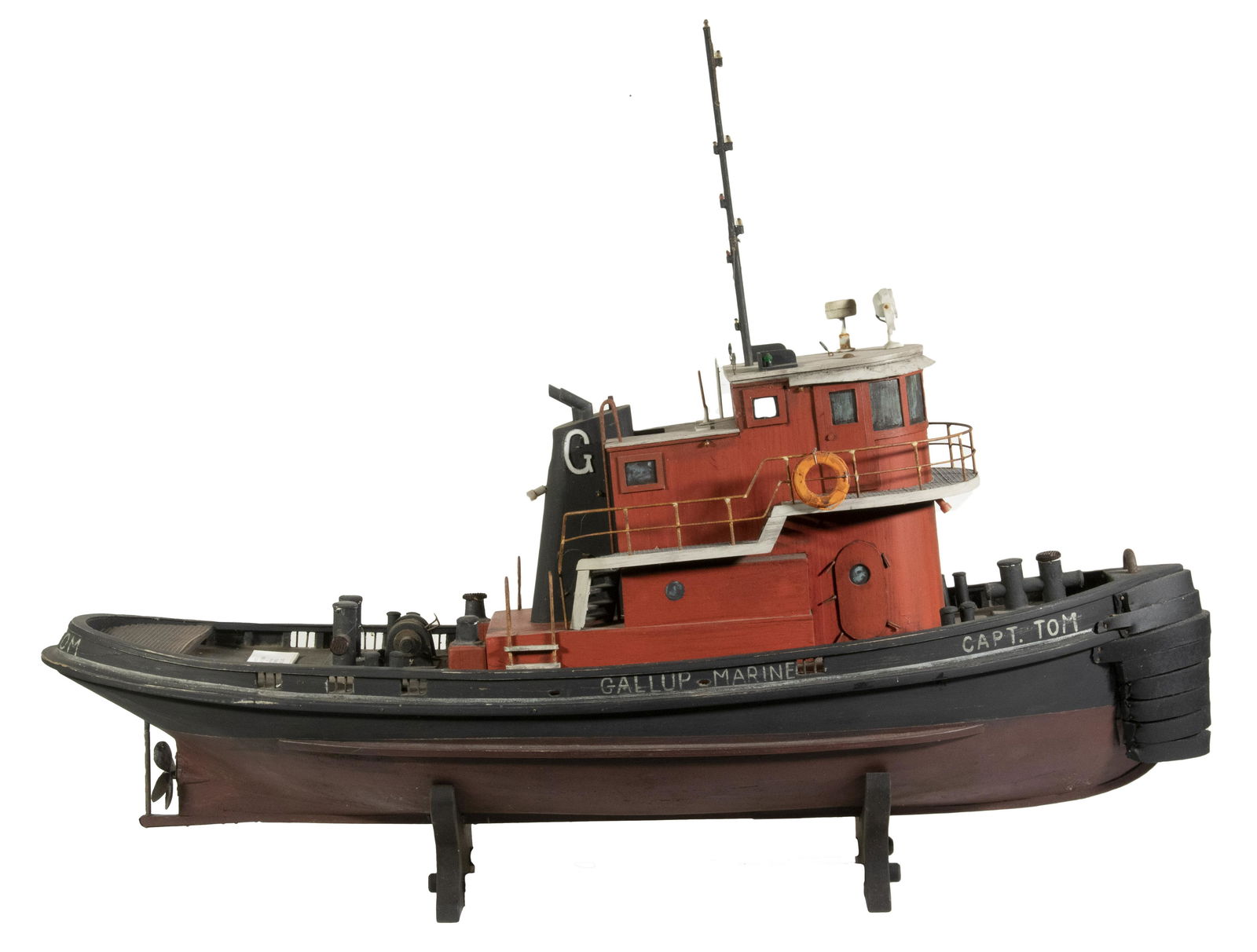 MODEL OF 380 HP TWIN SCREW TUG BOAT "CAPT. TOM": Folk Art Model of the Tug 'Capt. Tom', scratch-built by Robert Alvarez. Painted wood with metal detailing, 29" x 38" x 11", good condition. Built in 1969, by Diamond Manufacturing Incorporated of Sava