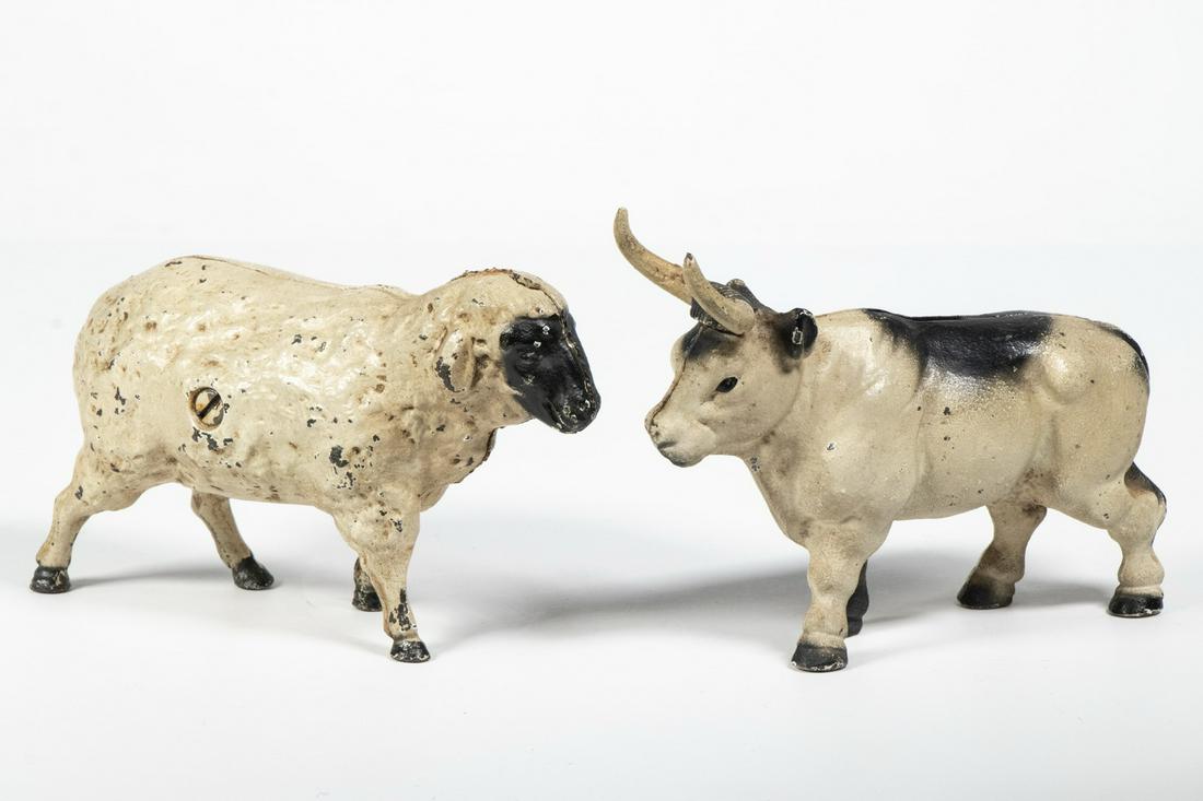 (2) CAST IRON ANIMAL FORM STILL BANKS: Including: Bull with long horns, 3 3/4" high; and Painted lamb, by John Wright, 1970s, 3 1/2" high. Paint losses.