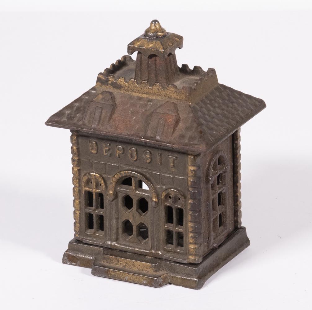 KENTON DEPOSIT BANK BUILDING STILL BANK: Early 20th c. Cast Iron Architectural Bank by Kenton Hardware (Kenton, OH), depicting a "Deposit" bank building with mansard roof, traces of original gilded paint, 4" high. Paint losses.