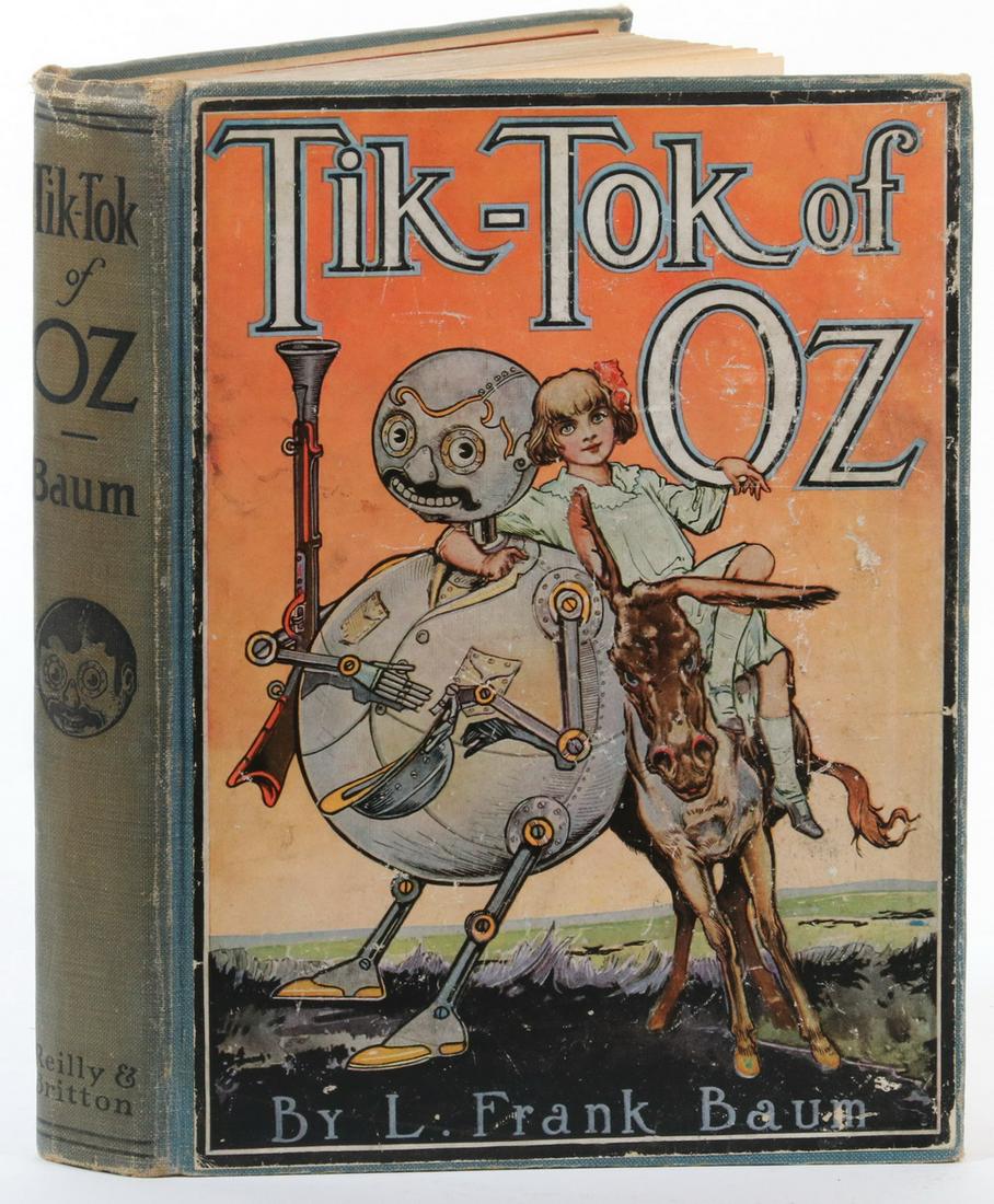 SCARCE OZ BOOK: "Tik-Tok of Oz" by L. Frank Baum, Illustrated by John R. Neill, Reilly & Britton Co. Chicago, 1914. Green cloth binding with black title on spine, applied full front board illustration, map of Oz on e