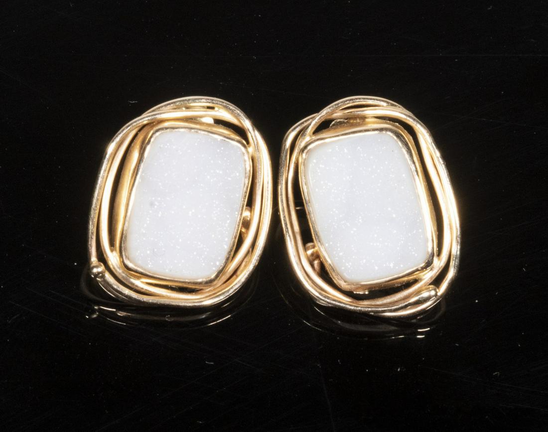 CUSTOM DESIGNER EARRINGS: Pair of 14K gold stud earrings with woven framework and white stones. Signed "David" 1/1 14K. 5/8" x 1/2" 3.6 dwt.